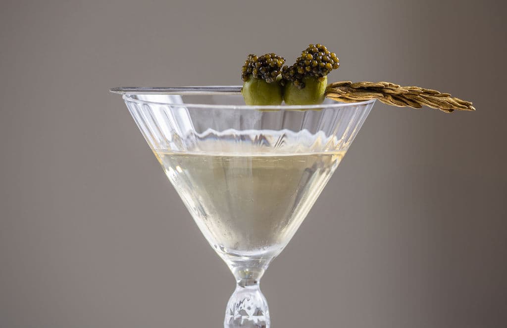 Dirty martini with olives and caviar